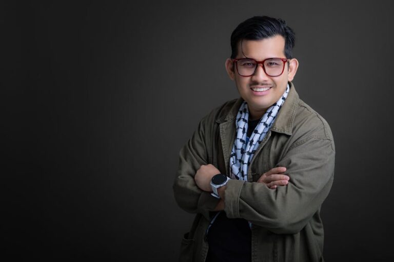 Portrait of an adult male in Tanjung Tokong, Penang, wearing a jacket and kuffiyeh. Studio photography.