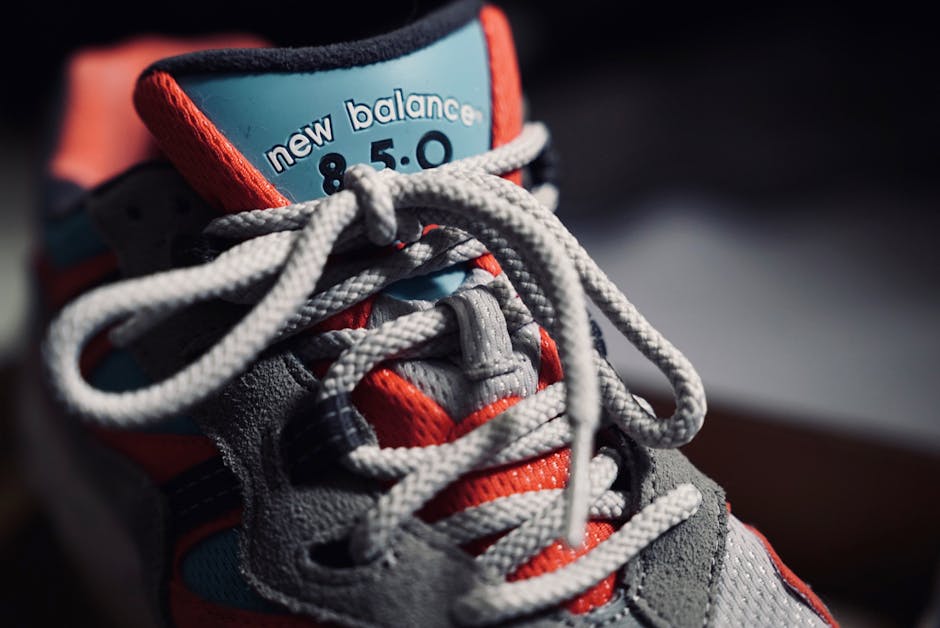 Detailed close-up of a colorful sneaker showcasing intricate shoelace design and vibrant colors.