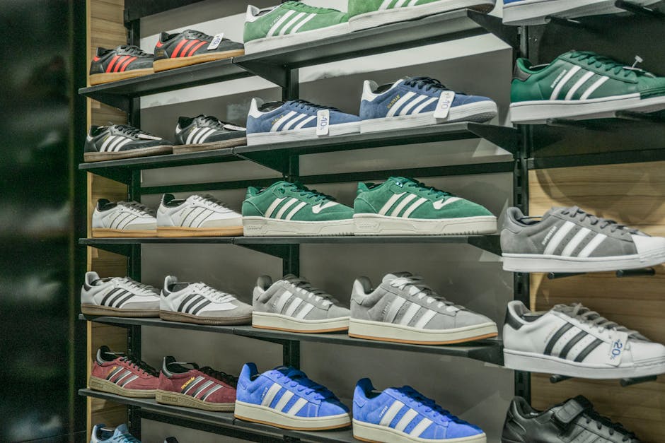 Colorful sneakers arranged on store shelves showcasing trendy footwear options.
