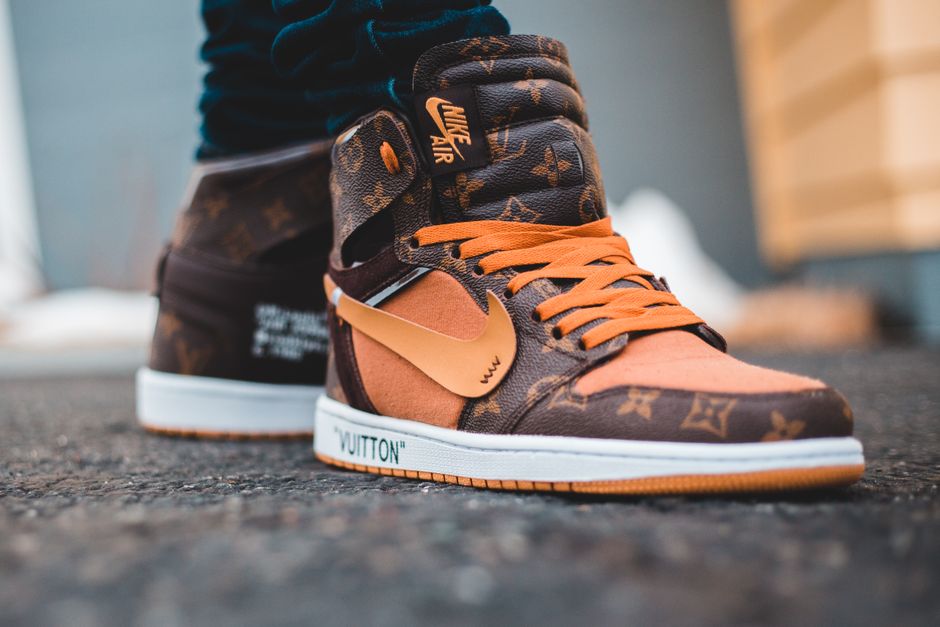 Close-up of luxury Nike Air sneakers with Louis Vuitton design, showcasing style and fashion detail.